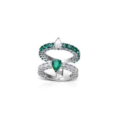 Double eternity ring featuring emerald and diamond accents in a layered design.