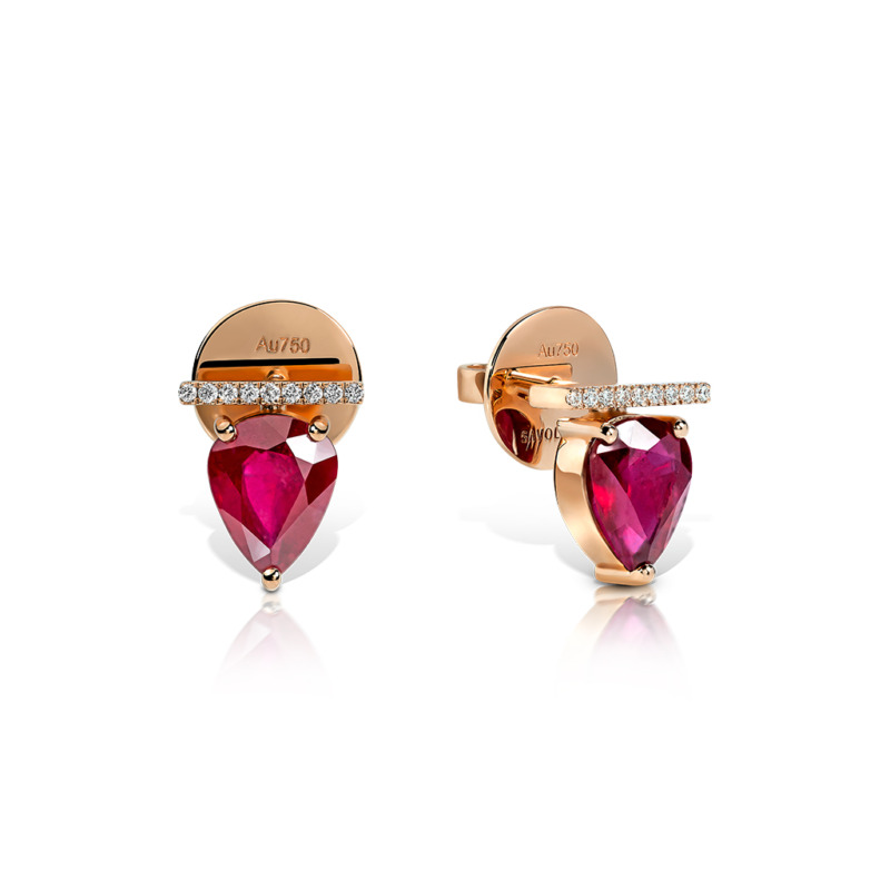 Heart-shaped ruby stud earrings with gold and diamond accents.