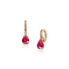 Ruby ear cuff featuring a teardrop-shaped gemstone and diamond accents in a gold setting.