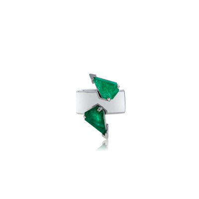 White ear cuff featuring two green triangular gemstones set in silver accents.