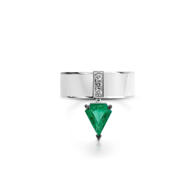 Silver ring featuring a kite cut emerald and small diamonds on a band.