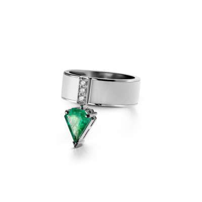 Ring featuring a kite cut emerald and diamond accents set in a silver band.