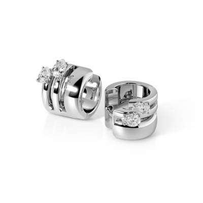Stylish silver earrings with three sparkling diamonds, showcasing a modern design perfect for various occasions.
