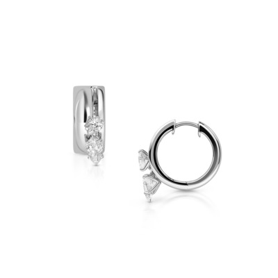 Silver hoop earrings featuring diamond accents, showcasing a modern design with a touch of elegance and sparkle.