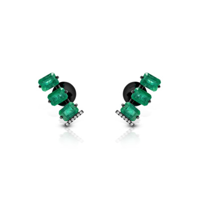 Emerald earrings featuring rectangular stones and diamond accents, showcasing a modern jewelry design with a striking green color.