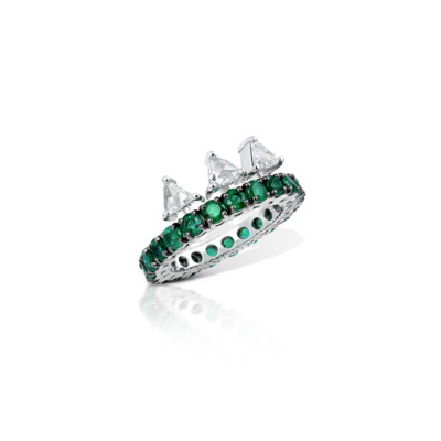 Ring featuring emerald and diamond stones set in a silver band with triangular diamond accents.