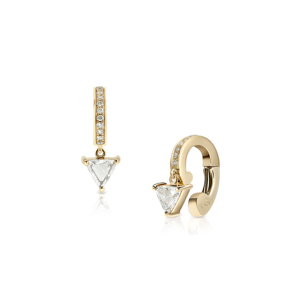 Gold earcuff featuring a triangular clear stone and a row of smaller clear stones.