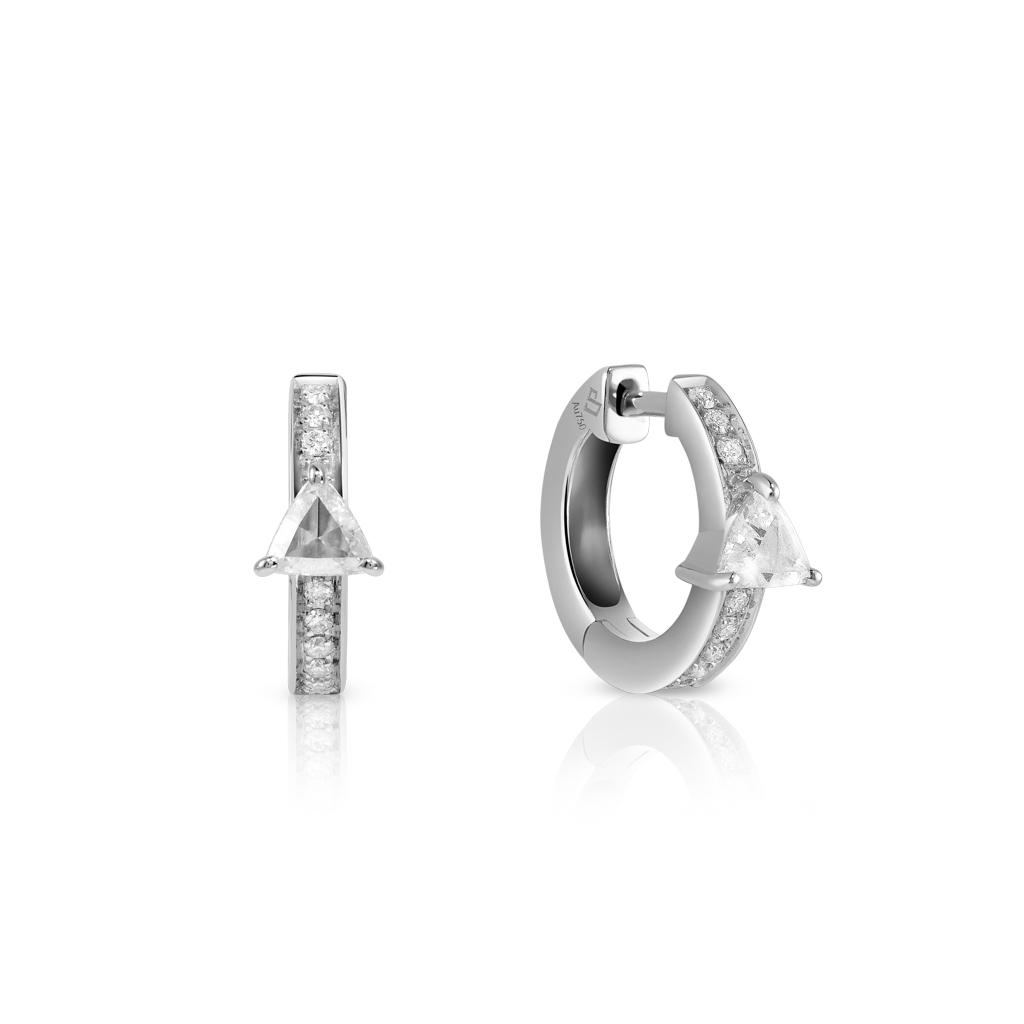 Silver hoop earrings featuring a triangle gemstone and small clear stones along the side.