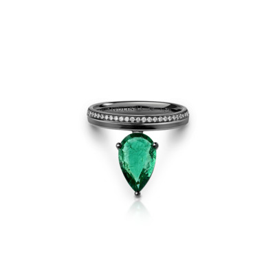 Ring featuring a pear-shaped emerald stone set in a black band with small diamonds.