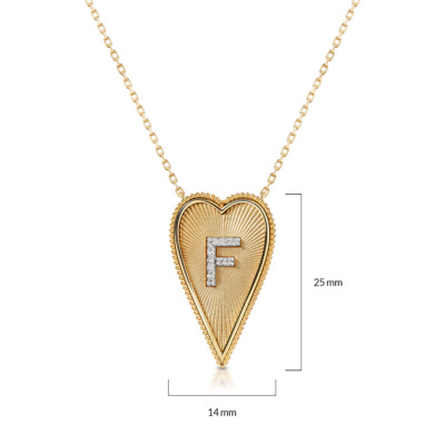 Gold elongated heartbeat necklace featuring the letter F in diamonds.