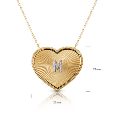 Gold heart-shaped necklace featuring a textured design and the letter M in diamonds.