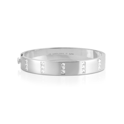 White gold bangle featuring five rows of diamonds set in a sleek design.
