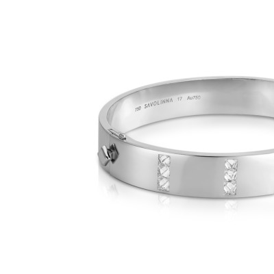 Silver bangle featuring five rows of diamonds set in a polished band.