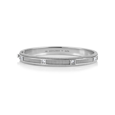 Matte white gold bangle with diamond accents and textured design.