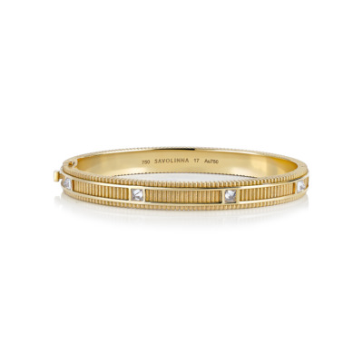 Gold matte bangle featuring diamond accents and a textured design.