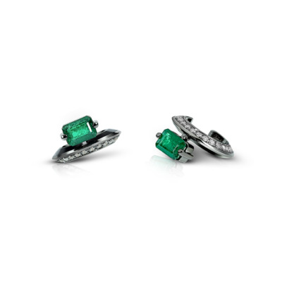 Emerald ear cuff featuring a rectangular emerald stone and a row of small clear stones.