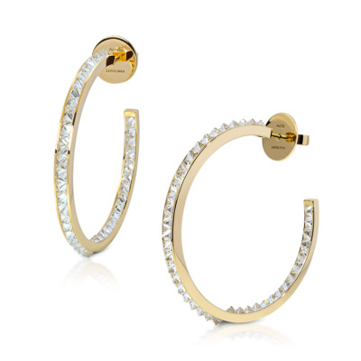 Single row hoop earrings made of yellow gold with diamond embellishments along the edge.
