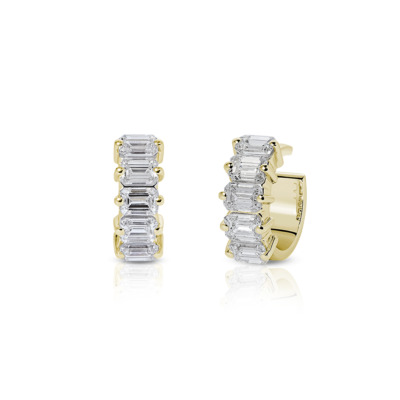 Gold ear cuff featuring a row of emerald cut diamonds set in a vertical arrangement.