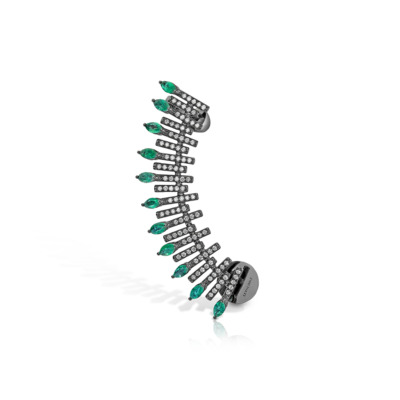 Ear climber earring featuring emerald stones arranged in a spiked design with silver accents.