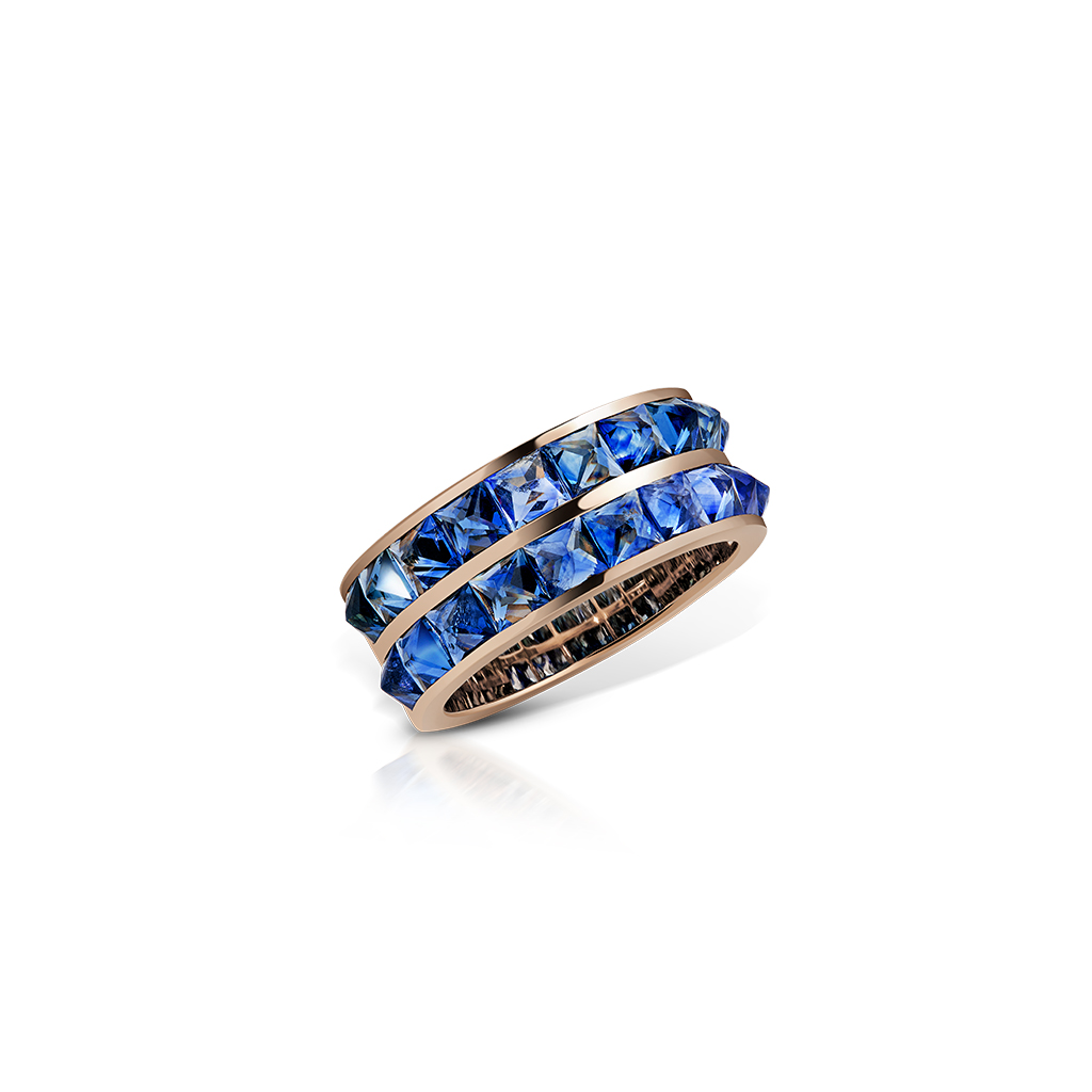 Double row band ring featuring blue sapphires set in a rose gold band.