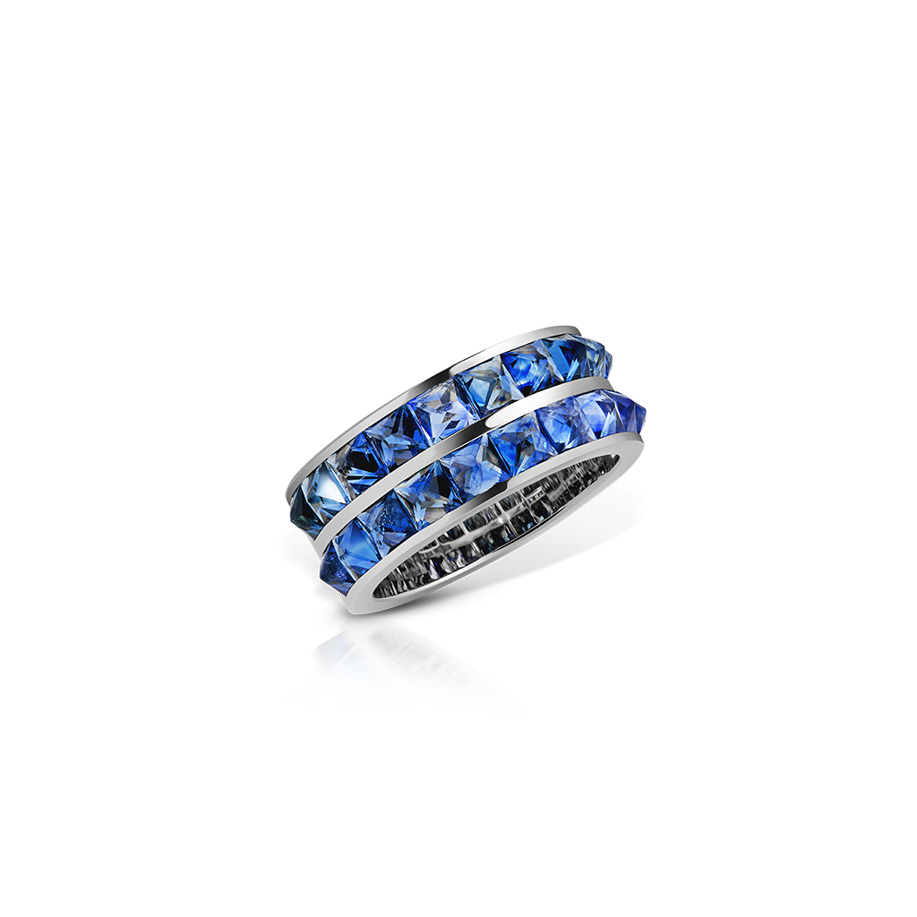 Double row band ring featuring blue sapphires set in a silver-tone metal.