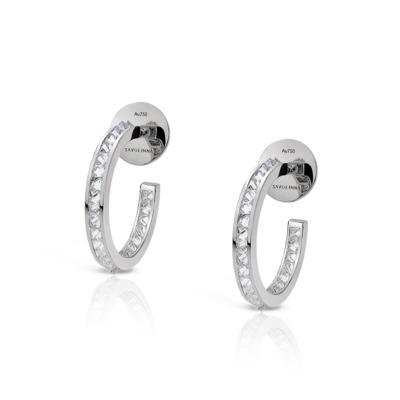 A pair of single row diamond hoop earrings made of white gold.