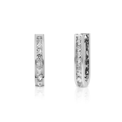 Large huggie earrings featuring a single row of diamonds set in white gold.
