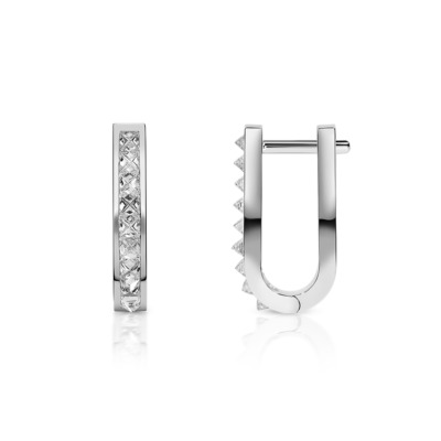 Large huggie earrings featuring a single row of diamonds set in white gold.