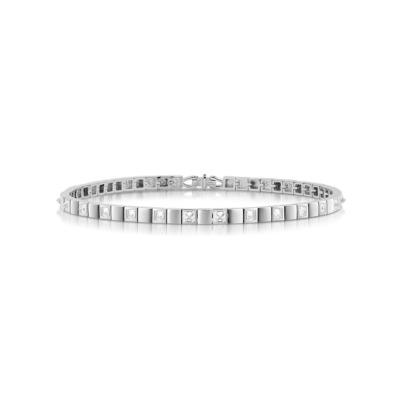 Slim tennis bracelet featuring alternating diamond and metal square links in white gold.