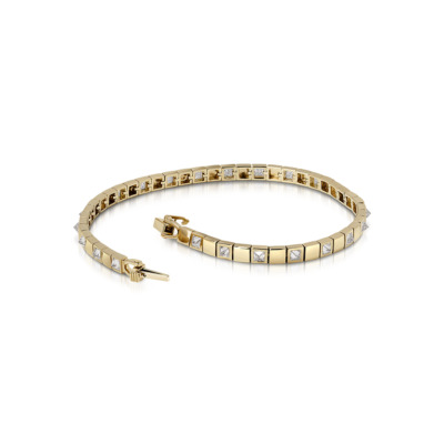 Gold tennis bracelet featuring alternating square and diamond-shaped stones.