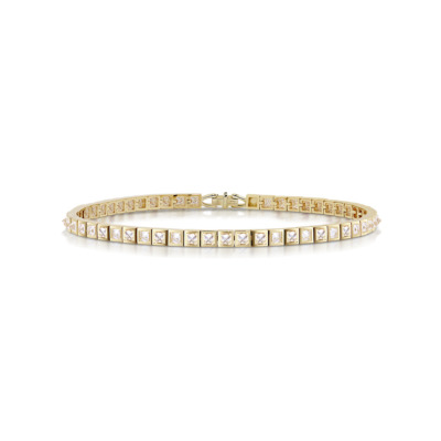 Slim tennis bracelet featuring square diamonds set in a yellow gold band.