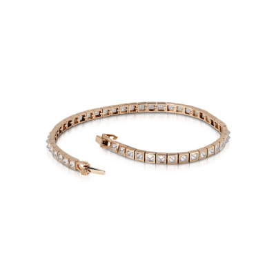 Slim tennis bracelet featuring diamond accents set in a rose gold band.