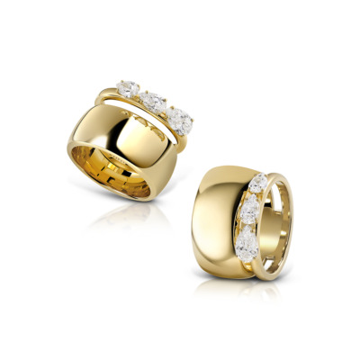 Gold ring featuring three diamonds set in a curved band design.