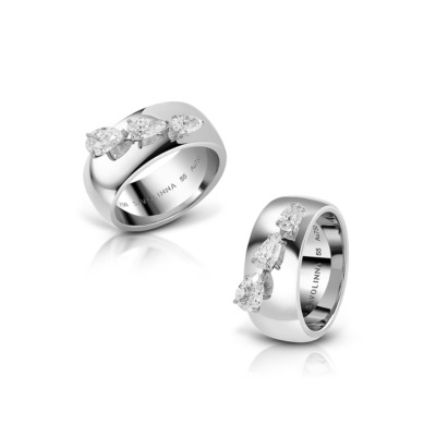 Silver ring featuring three pear-shaped diamonds set in a polished band.