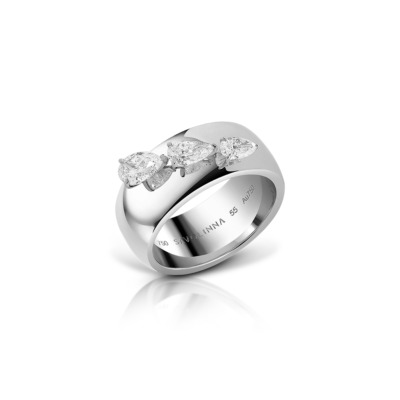 Three stone diamond ring with marquise cut diamonds set in a polished white gold band.