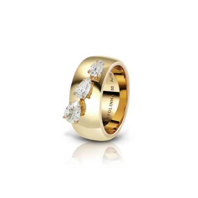 Gold ring featuring three diamond accents set in a channel design.