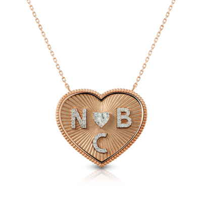Rose gold heart necklace featuring initials N, B, C and a heart symbol in the center.
