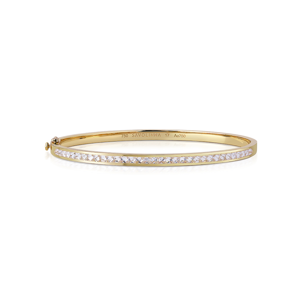 Gold bangle featuring a single row of diamonds set in a slim design.
