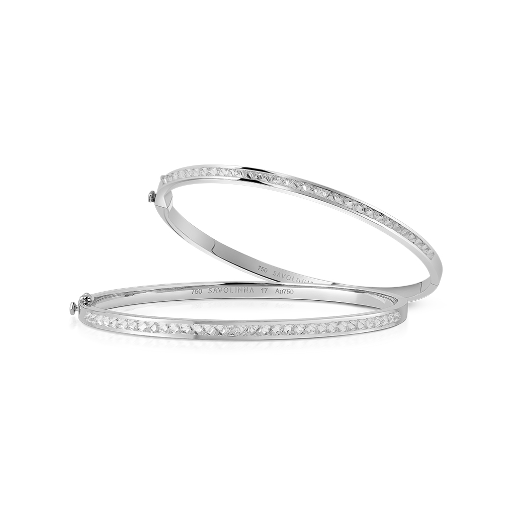 Two extra slim bangles with single rows of diamonds set in white gold.