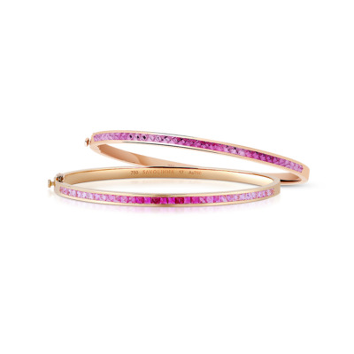 Two extra slim bangles featuring a single row of pink sapphires set in rose gold.
