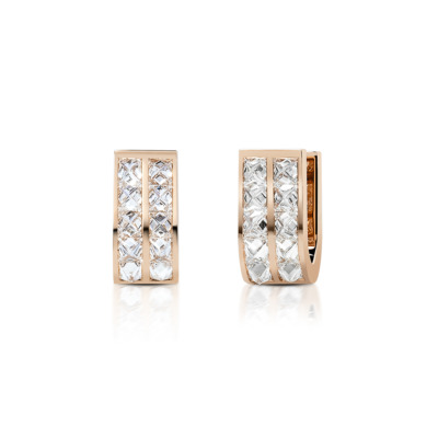 Mini huggie earrings featuring a double row of diamonds set in rose gold.