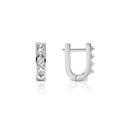 Mini huggie earrings featuring a single row of diamonds set in white gold.
