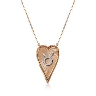 Elongated heart necklace featuring Taurus symbol in gold and silver, perfect for astrology enthusiasts and jewelry lovers.
