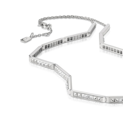 Slim choker necklace featuring diamond accents and a geometric design in white gold.