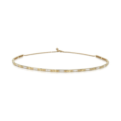 Slim choker necklace featuring diamonds set in yellow gold with a spiked design.