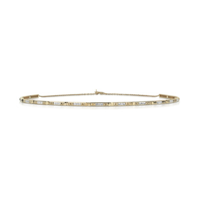 Slim choker necklace featuring diamonds set in yellow gold with a spiked design.
