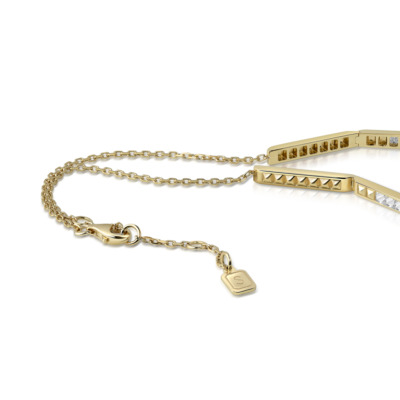 Slim choker necklace featuring diamond accents and yellow gold spikes with a clasp.
