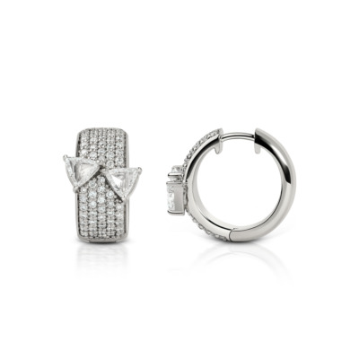 Pair of Huggies diamond earrings featuring triangular diamond accents and a polished silver finish.
