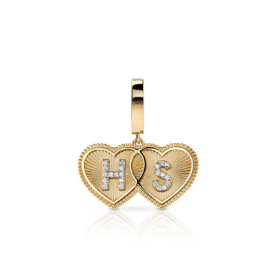 Gold double heart shaped charm featuring the initials HS and diamond accents.