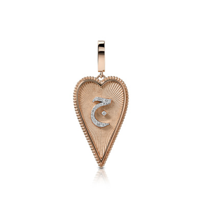 Rose gold heart-shaped pendant featuring a diamond accent in the center.